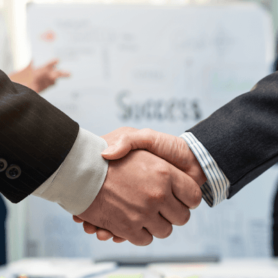 A close-up picture of a businessman shaking hands on a business cooperation agreement. Concept of Cooperation business and success